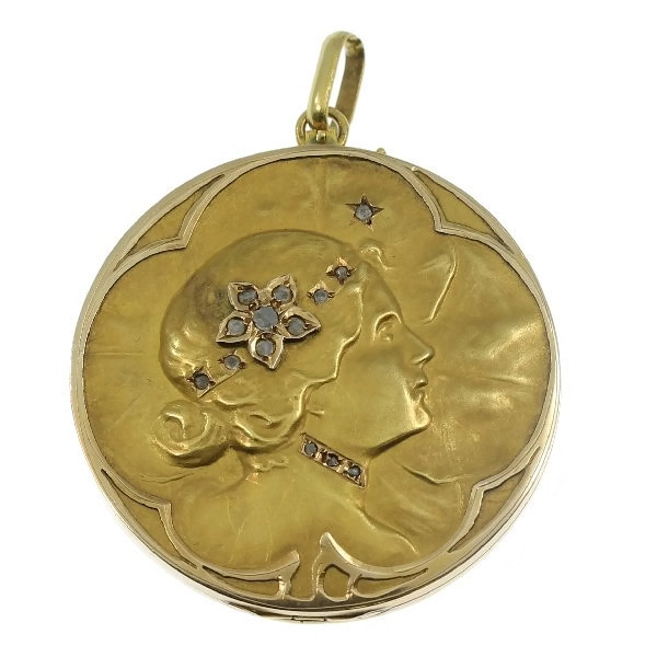 Art Nouveau pendant locket with ladies face and set with rose cut diamonds